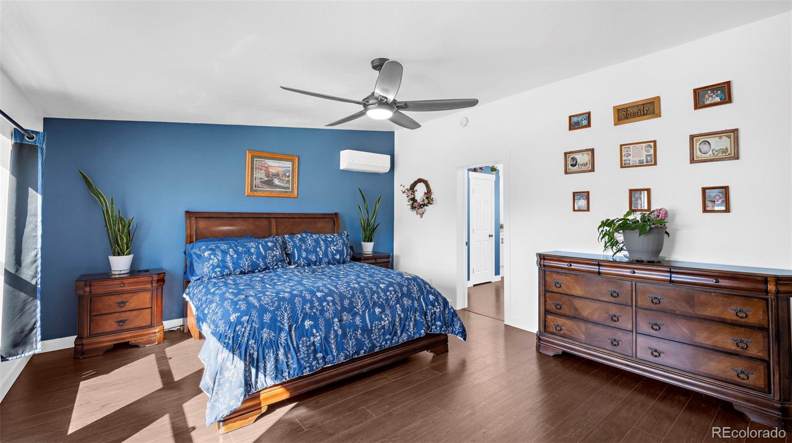 12340 Smith Road Peyton, CO 80831 - Photo 22 of 49 a bedroom with a bed and furniture