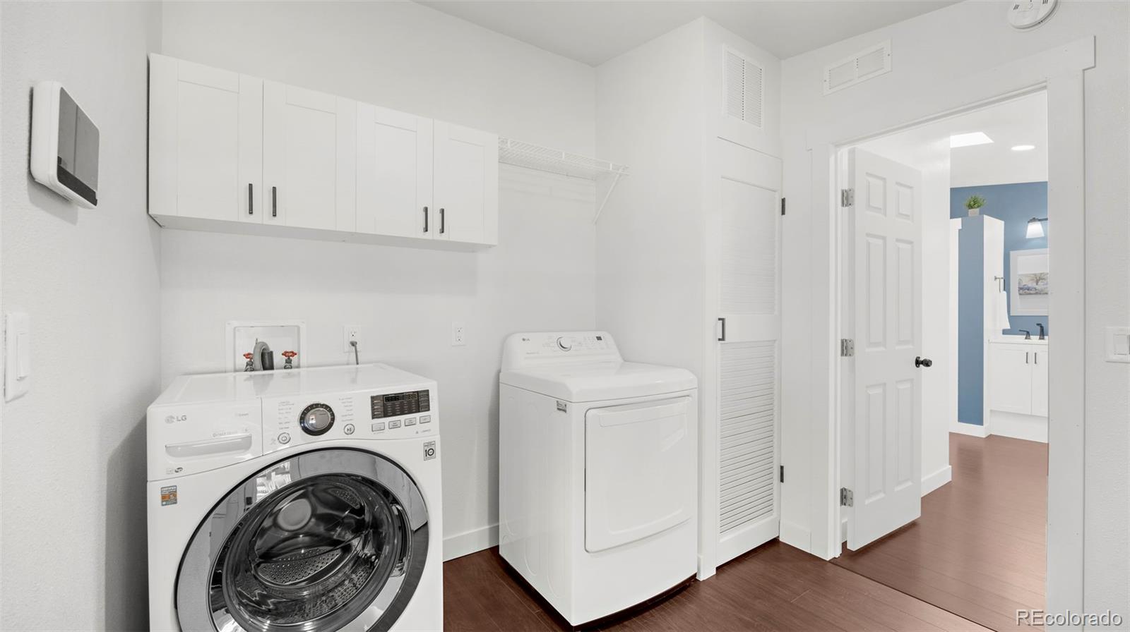 12340 Smith Road Peyton, CO 80831 - Photo 30 of 49 a view of storage and utility room with washer and dryer
