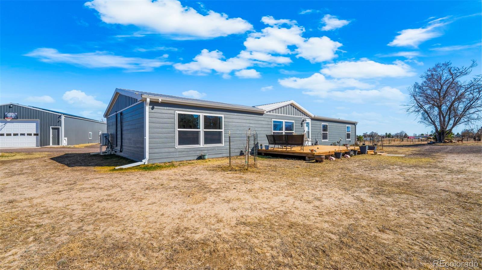 12340 Smith Road Peyton, CO 80831 - Photo 3 of 49 a house view with a seating space
