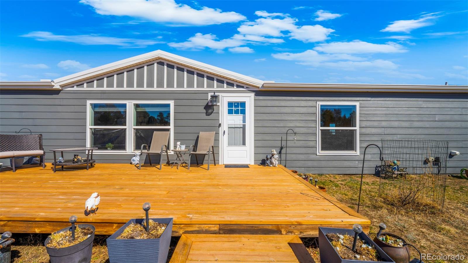 12340 Smith Road Peyton, CO 80831 - Photo 34 of 49 a view of a house with swimming pool
