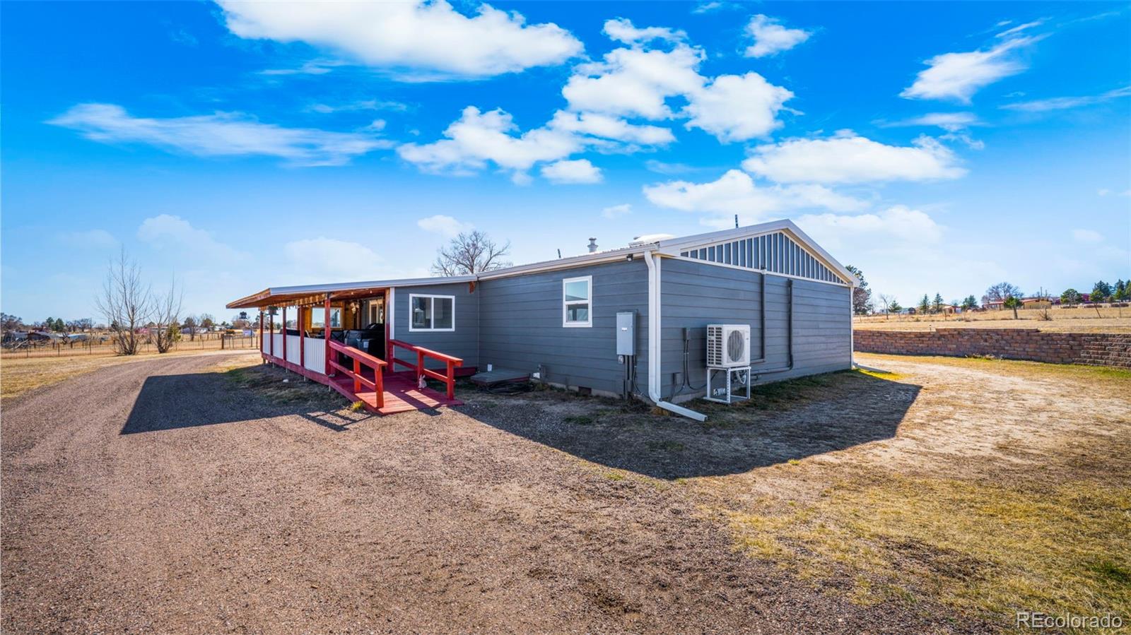 12340 Smith Road Peyton, CO 80831 - Photo 36 of 49 a view of a house with a yard
