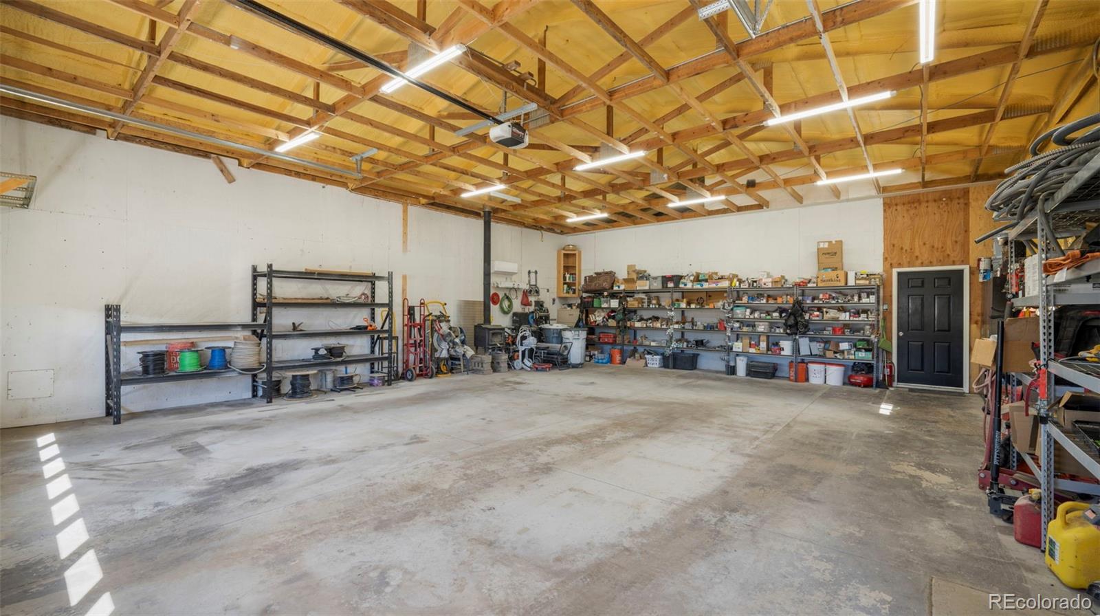 12340 Smith Road Peyton, CO 80831 - Photo 40 of 49 a view of a room with storage