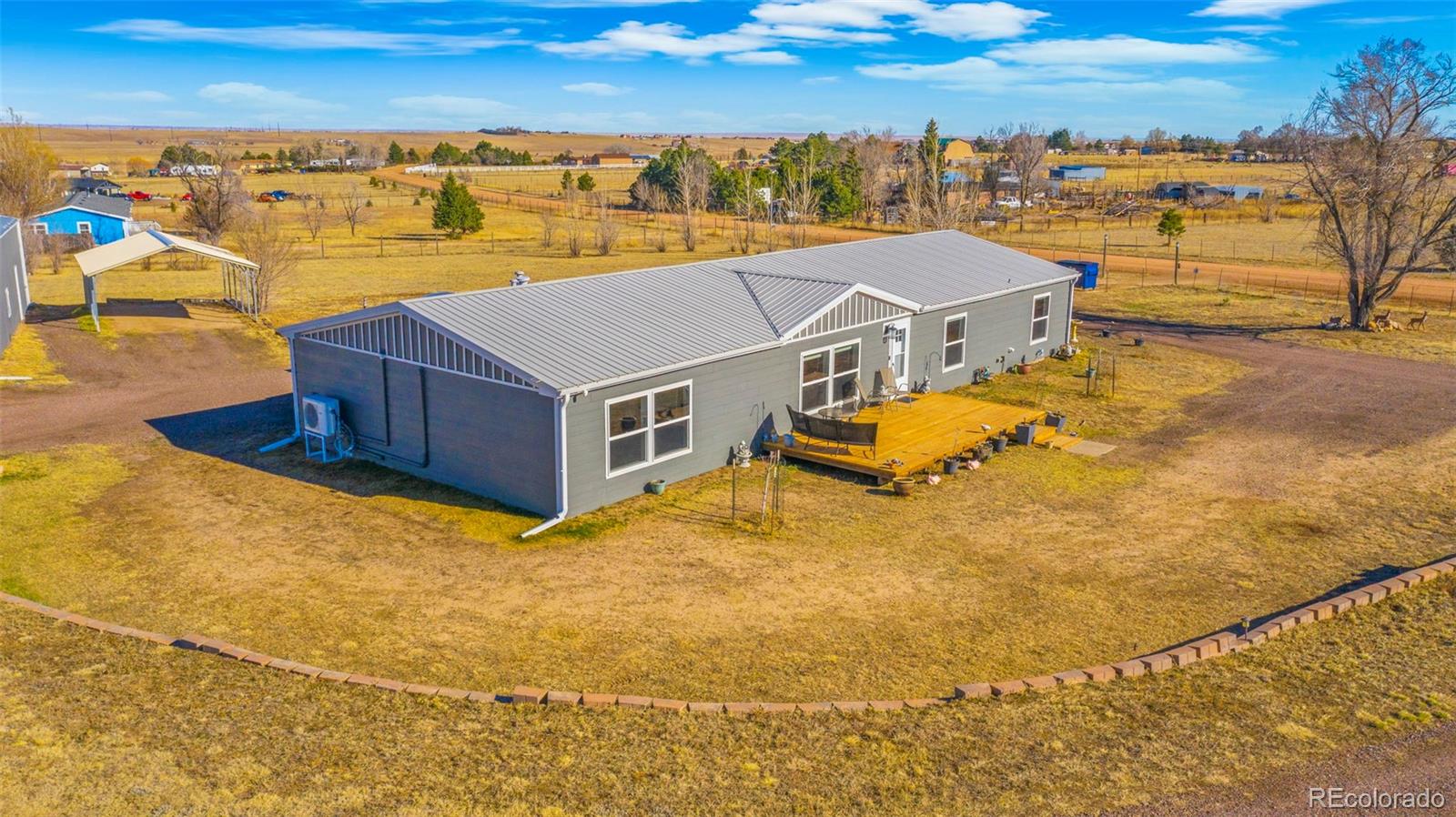 12340 Smith Road Peyton, CO 80831 - Photo 47 of 49 a view of a swimming pool with an ocean view
