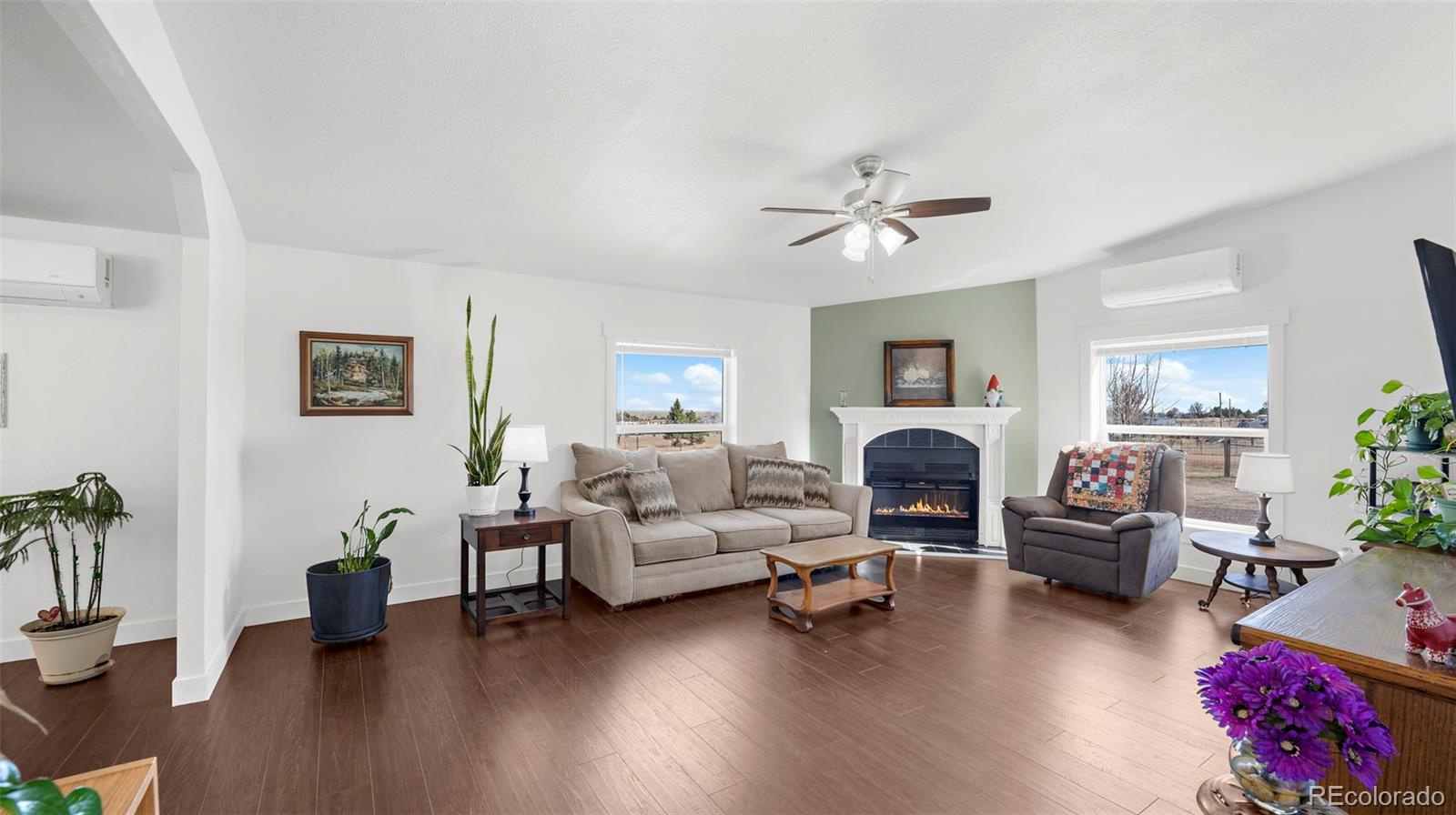 12340 Smith Road Peyton, CO 80831 - Photo 7 of 49 a living room with furniture and a fireplace