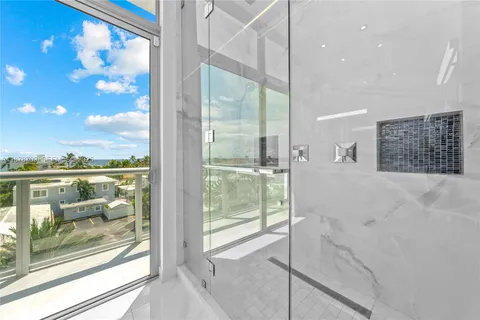 a view of a bathroom with a glass door