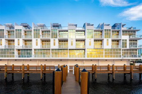 a view of a chairs and table in a backyard