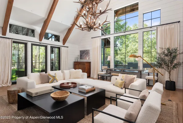 a kitchen with granite countertop a stove a sink and a refrigerator
