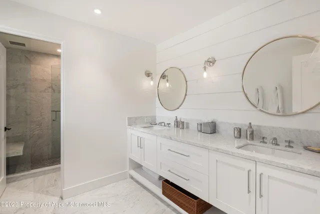 a view of a dining room with furniture large windows and wooden floor
