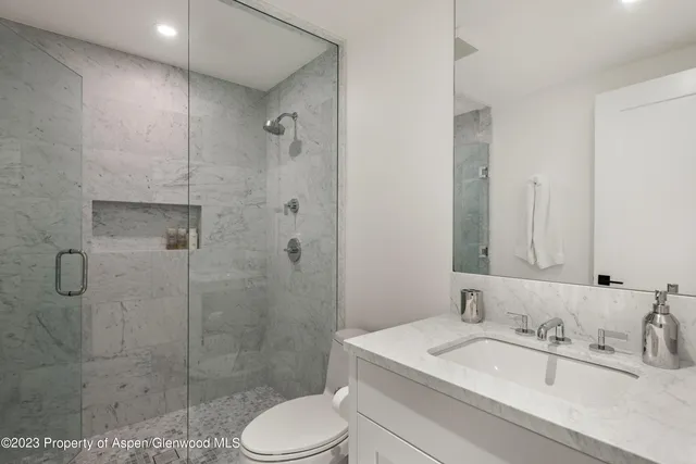 a living room with furniture fireplace and flat screen tv