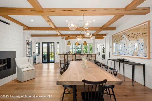 a bathroom with a glass shower door and a sink