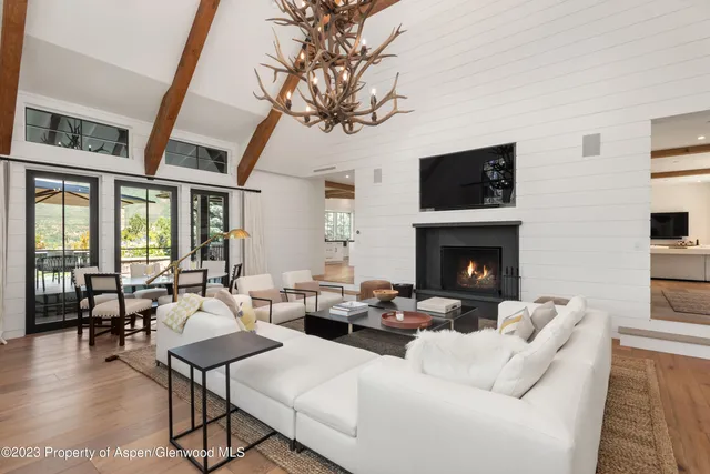 a front view of a house with patio and garden