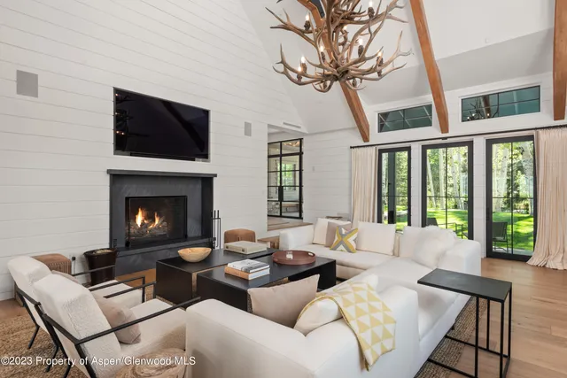 a view of a patio with table and chairs and potted plants
