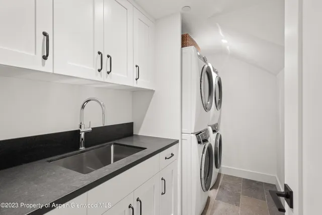 a view of a chairs and table in the balcony