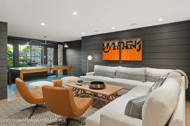 a view of a chairs and table in the balcony