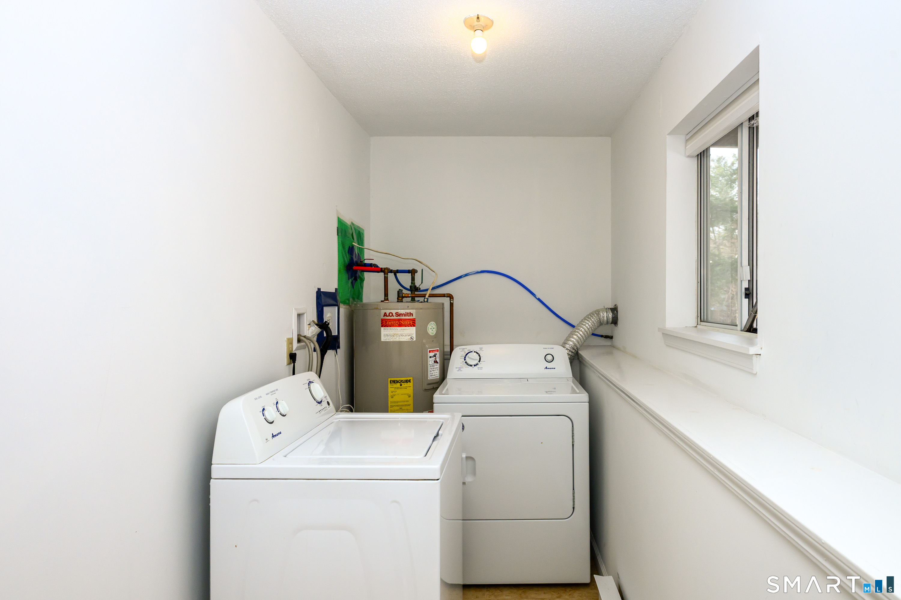 925 Oronoke Road, Unit 21A Waterbury, CT 06708 - Photo 30 of 39 a utility room with dryer and washer