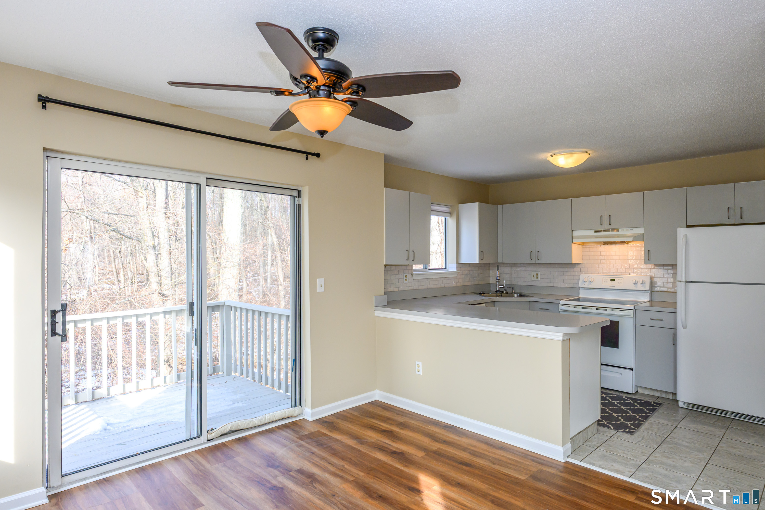 925 Oronoke Road, Unit 21A Waterbury, CT 06708 - Photo 3 of 39 a kitchen with stainless steel appliances granite countertop a stove and a refrigerator