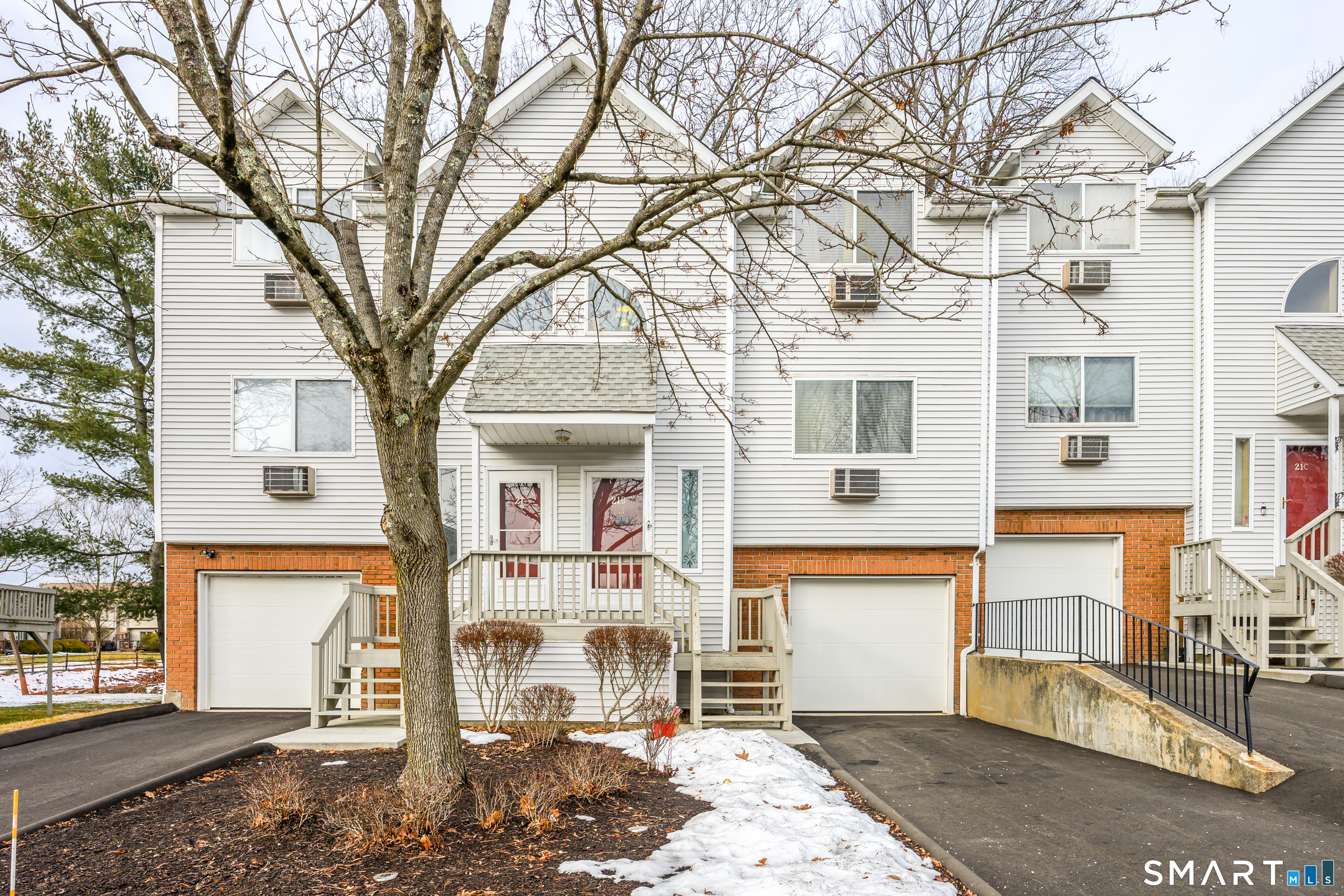 925 Oronoke Road, Unit 21A Waterbury, CT 06708 - Photo 36 of 39 a front view of a house with a tree