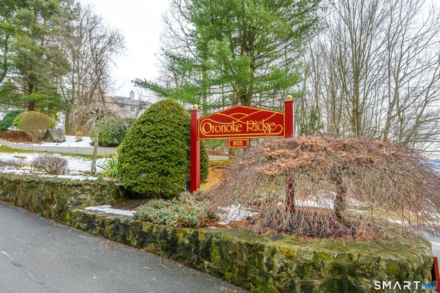 a sign that is on a brick wall