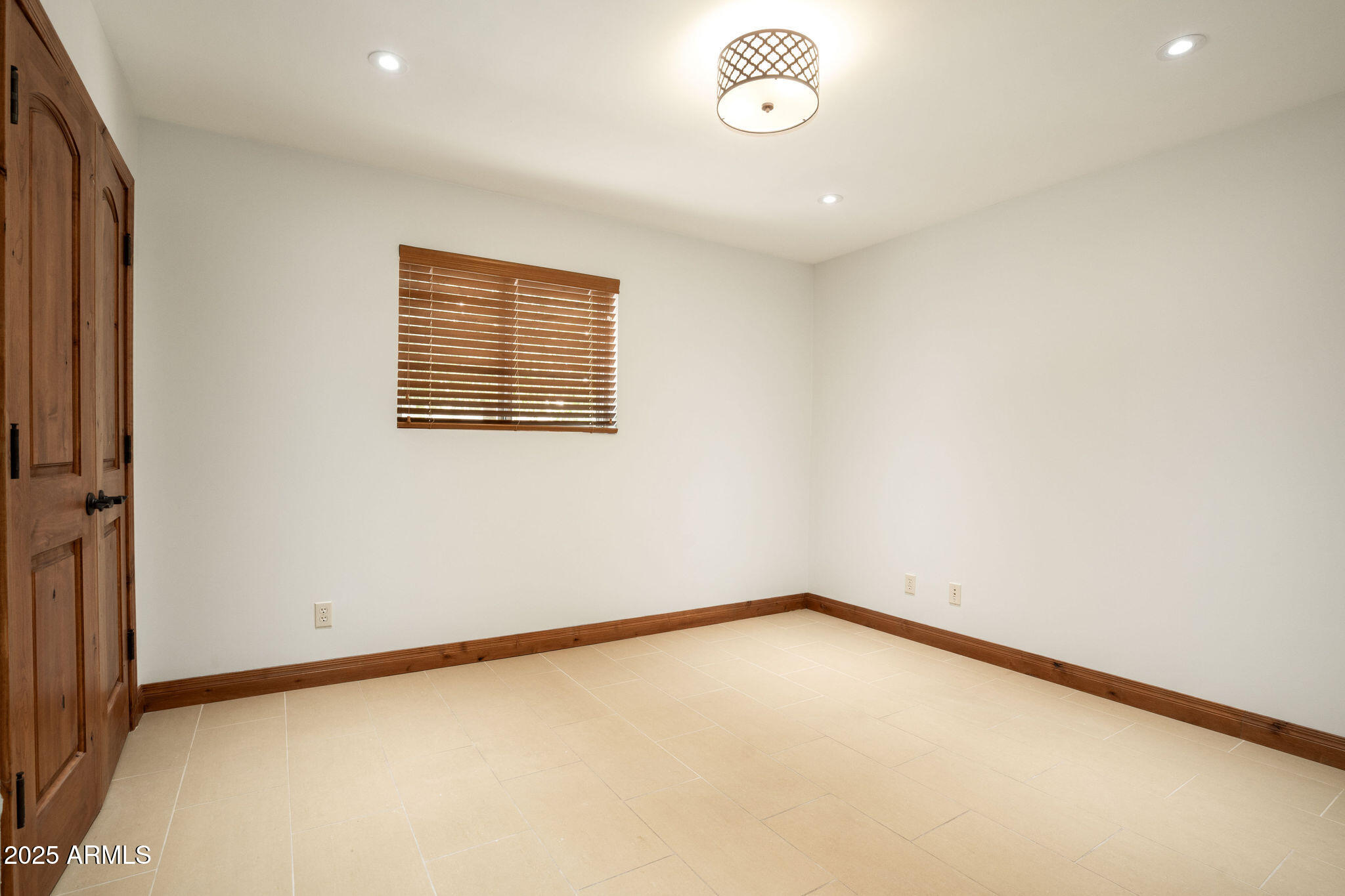 3608 North 56th Street Phoenix, AZ 85018 - Photo 11 of 18 an empty room with a window