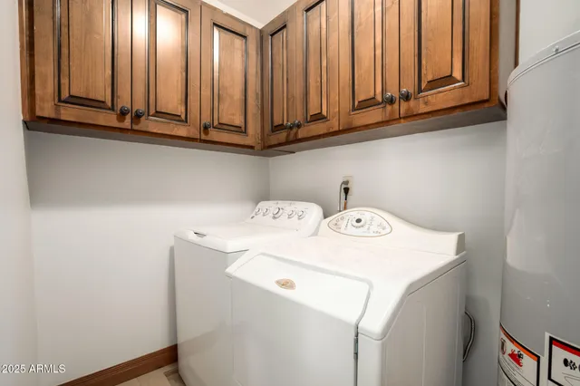 a view of a house with backyard and a tree