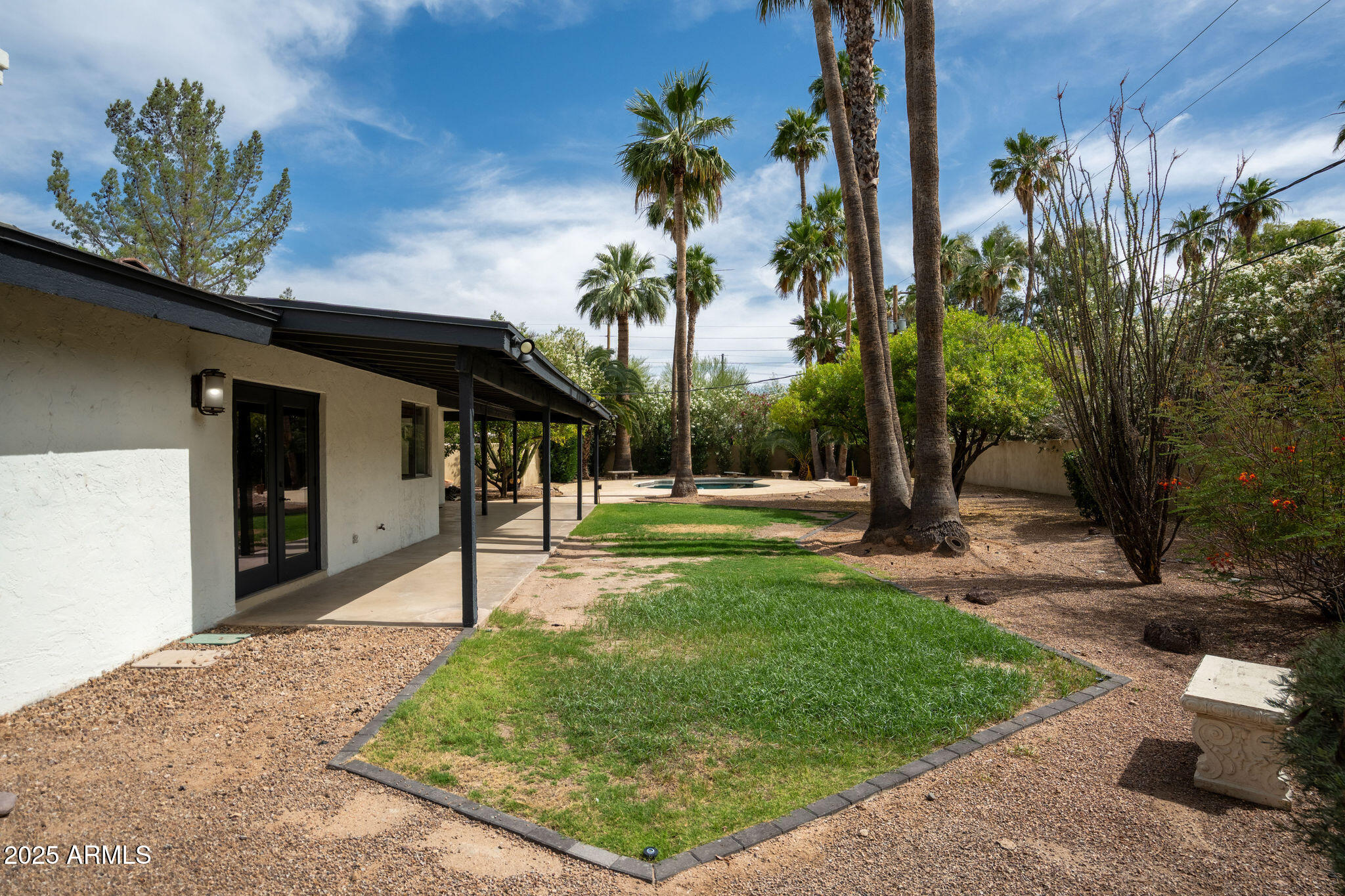 3608 North 56th Street Phoenix, AZ 85018 - Photo 14 of 18 a view of a house with backyard and a tree