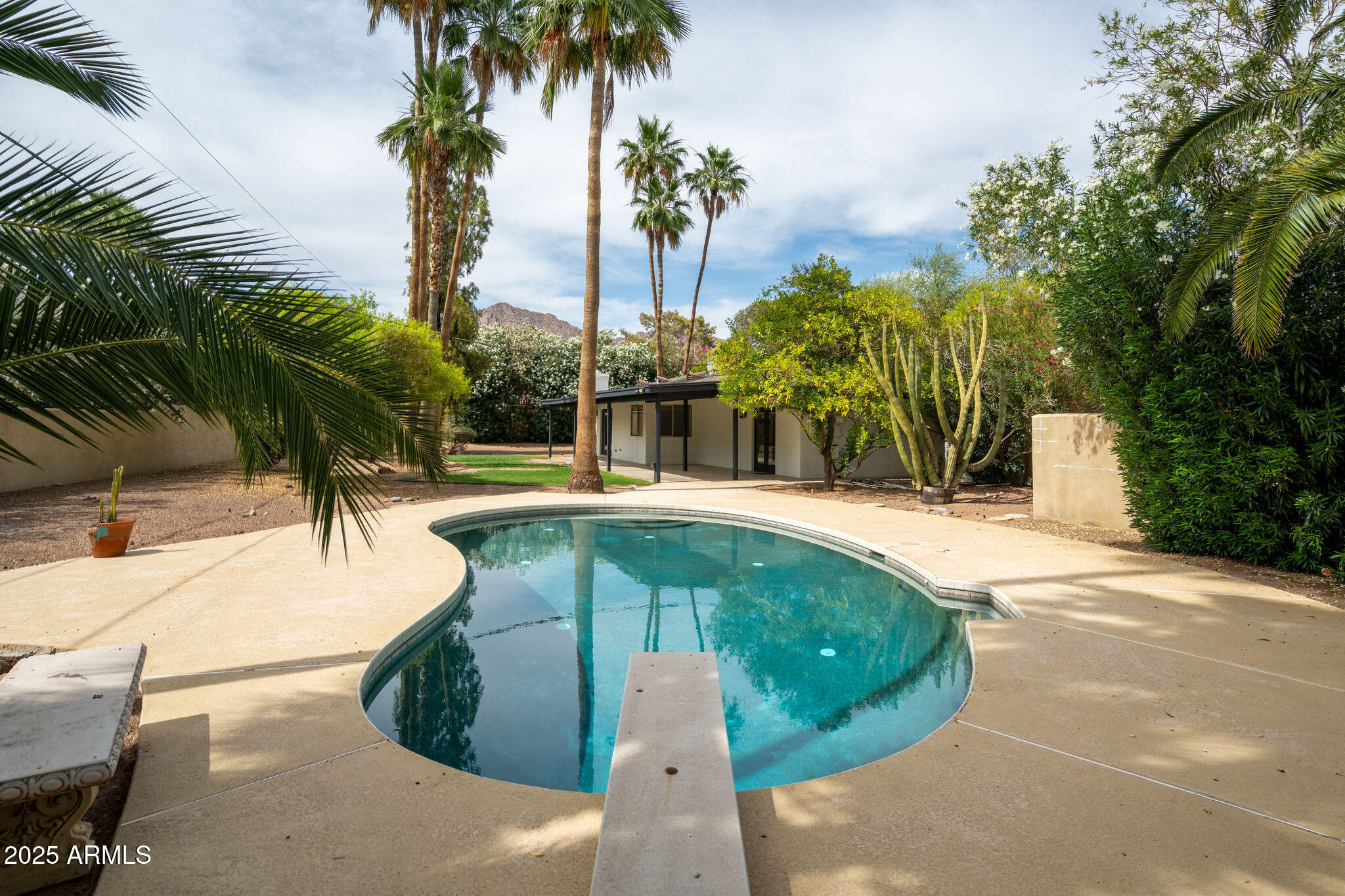 3608 North 56th Street Phoenix, AZ 85018 - Photo 16 of 18 a swimming pool with outdoor seating and yard