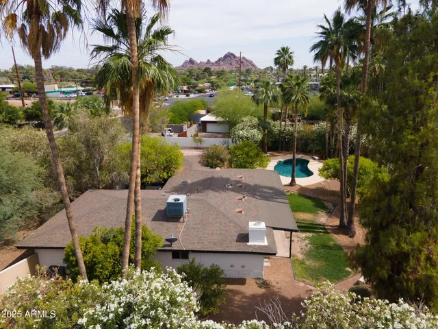an aerial view of residential houses and outdoor space