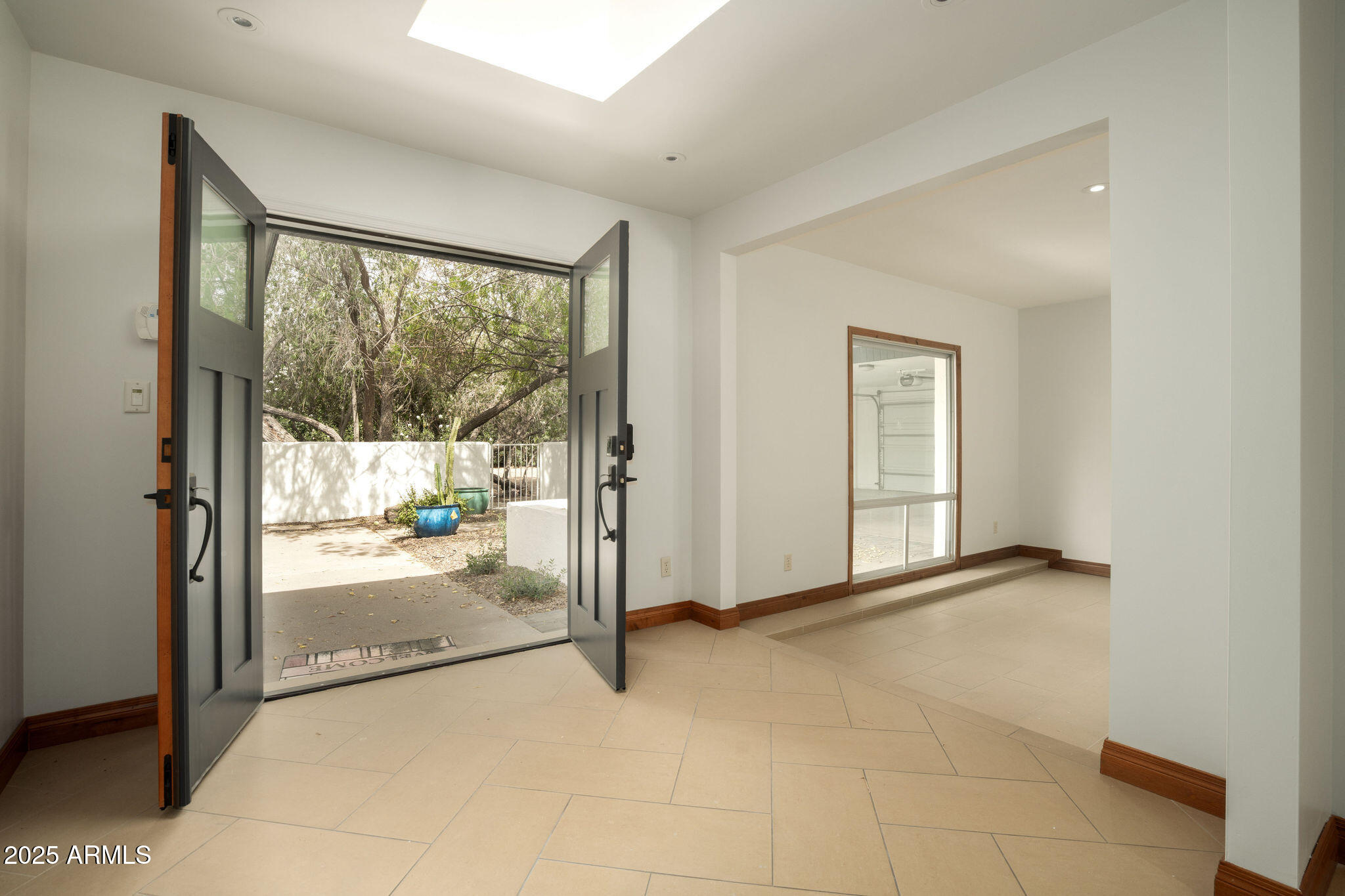 3608 North 56th Street Phoenix, AZ 85018 - Photo 2 of 18 a view of an empty room and window