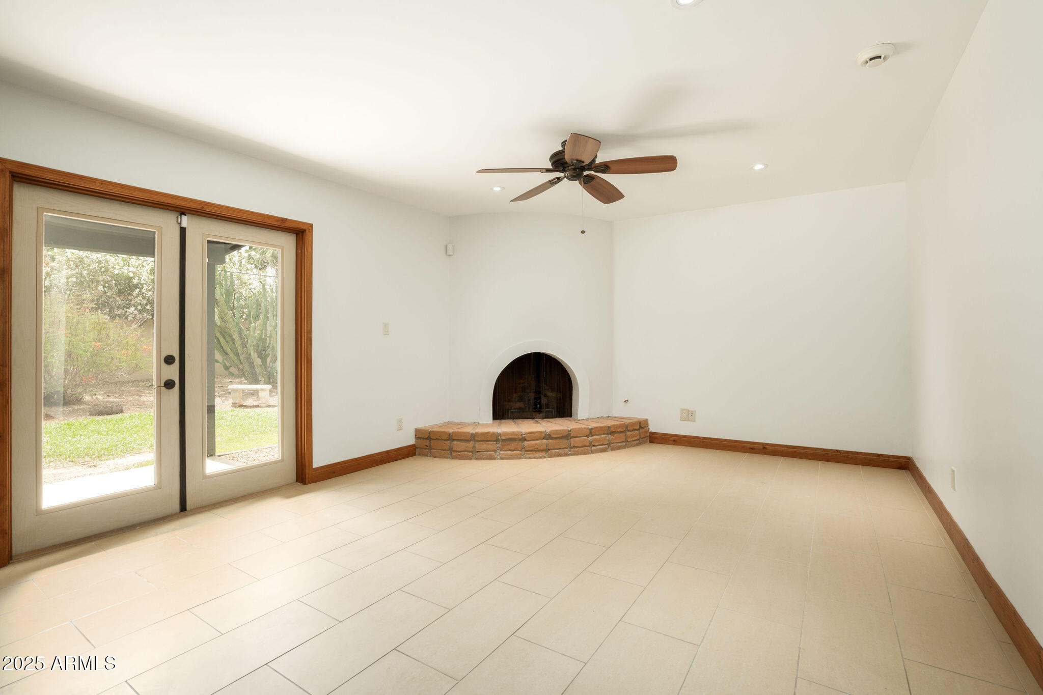 3608 North 56th Street Phoenix, AZ 85018 - Photo 6 of 18 a view of empty room with fireplace