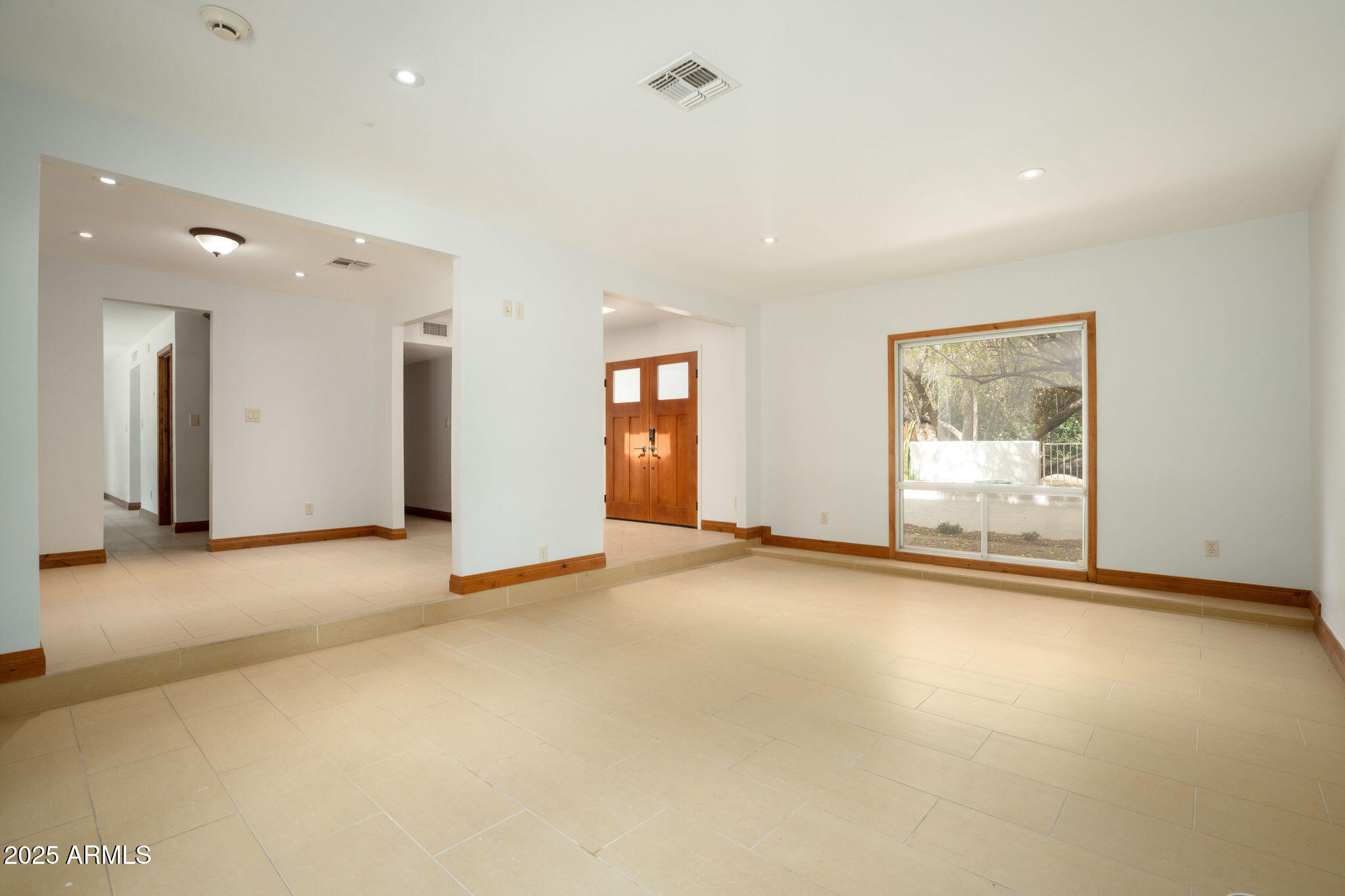 3608 North 56th Street Phoenix, AZ 85018 - Photo 7 of 18 an empty room with window and windows