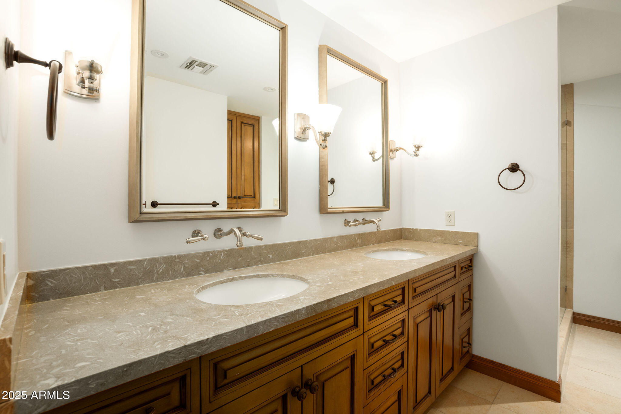 3608 North 56th Street Phoenix, AZ 85018 - Photo 9 of 18 a bathroom with a granite countertop sink and a mirror