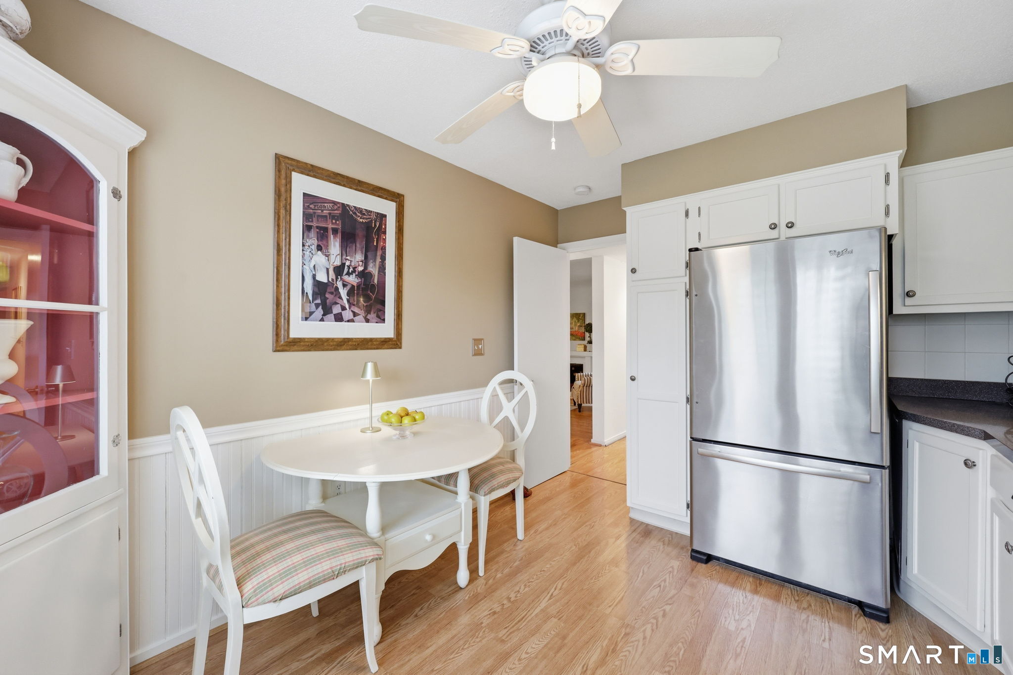 23 Maple Lane, Unit 23 Avon, CT 06001 - Photo 11 of 33 a kitchen with stainless steel appliances a dining table and chairs