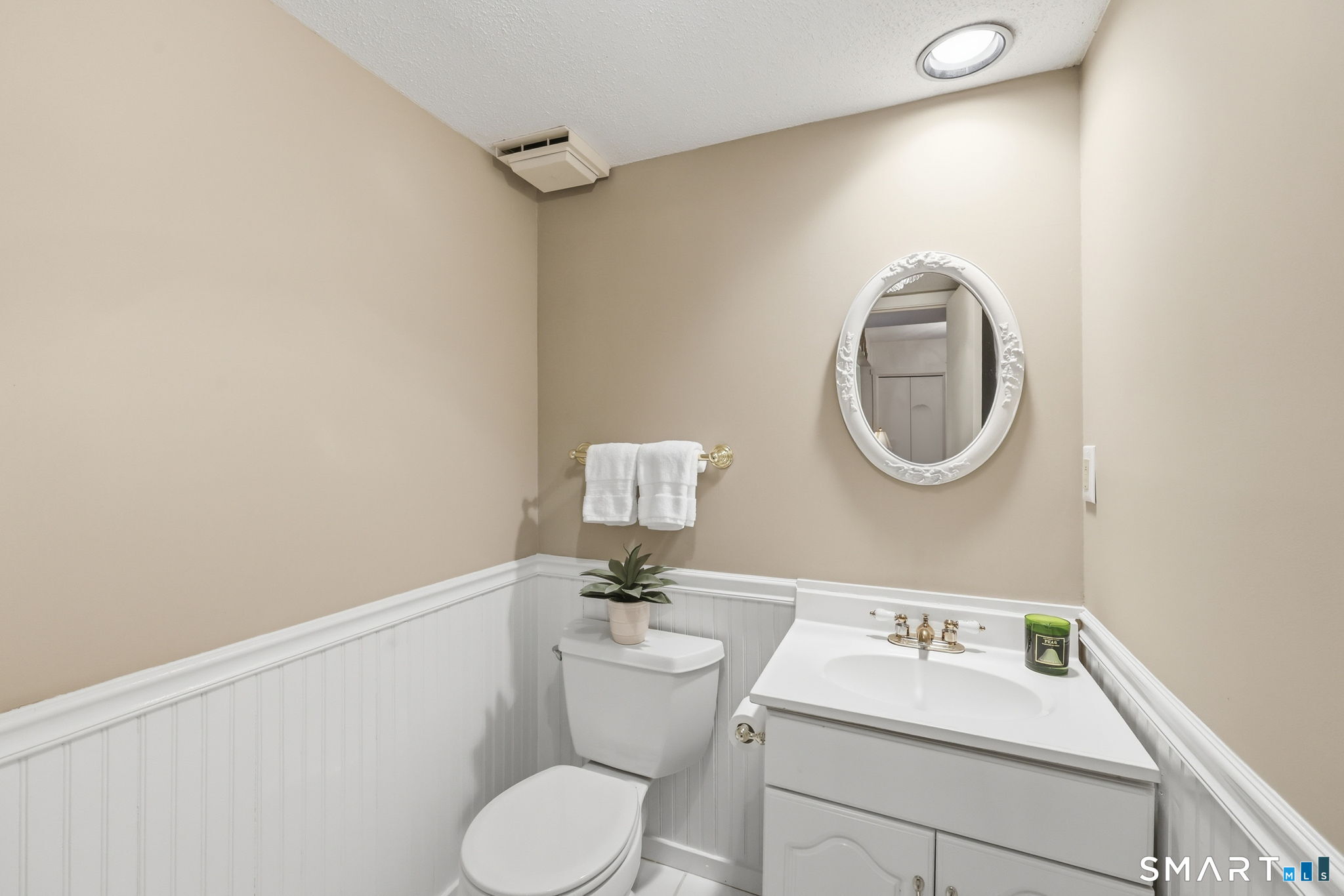 23 Maple Lane, Unit 23 Avon, CT 06001 - Photo 12 of 33 a bathroom with a sink mirror and toilet
