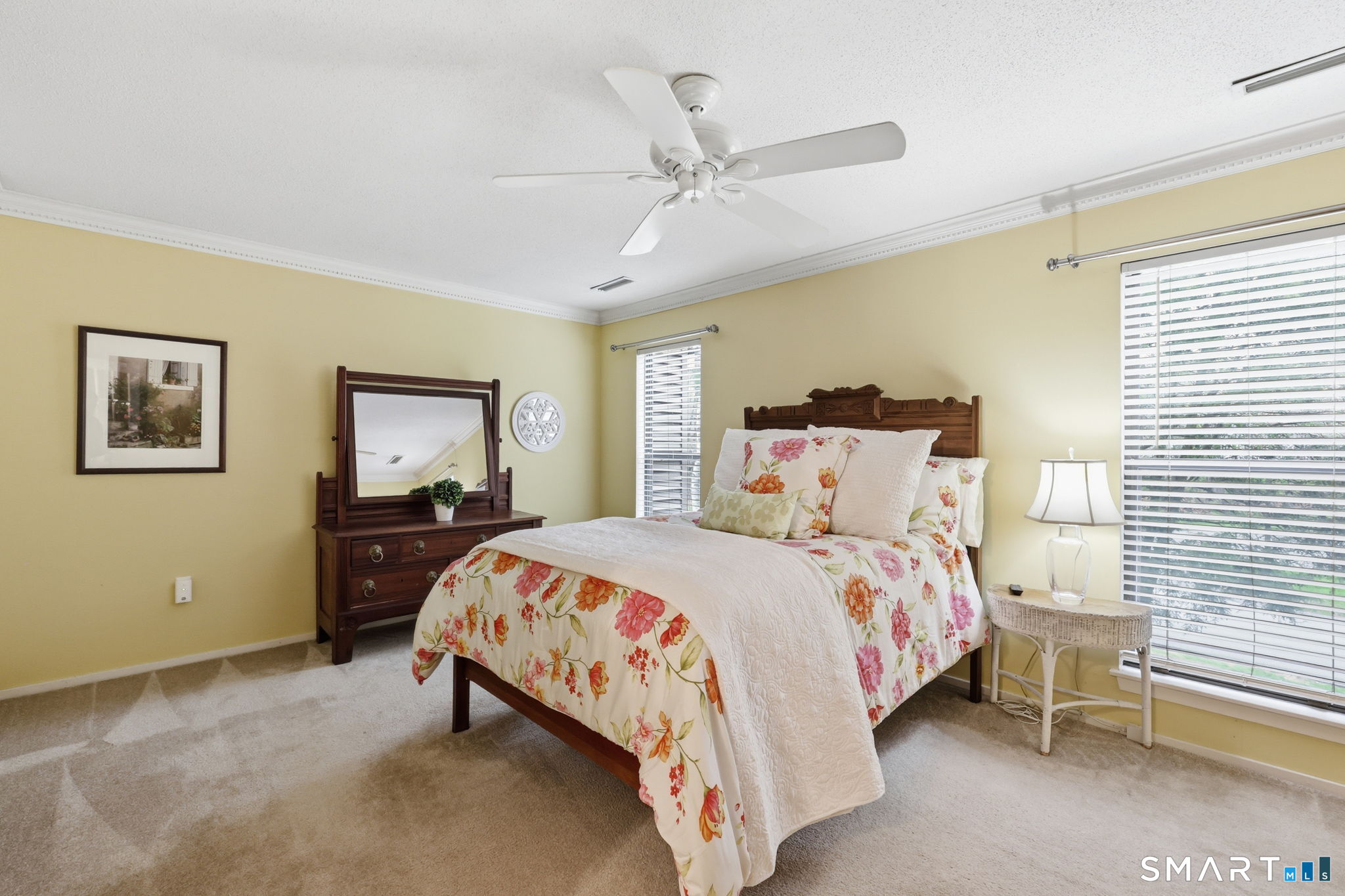 23 Maple Lane, Unit 23 Avon, CT 06001 - Photo 15 of 33 a bedroom with a bed and a chandelier