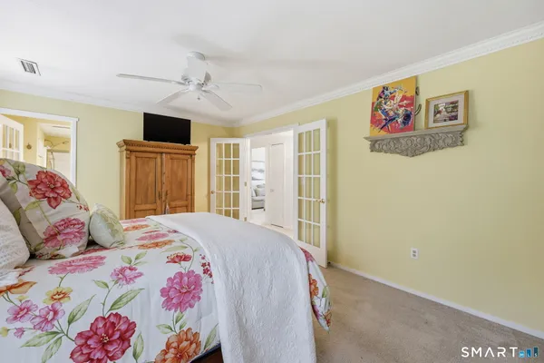 a bedroom with a bed and a dresser