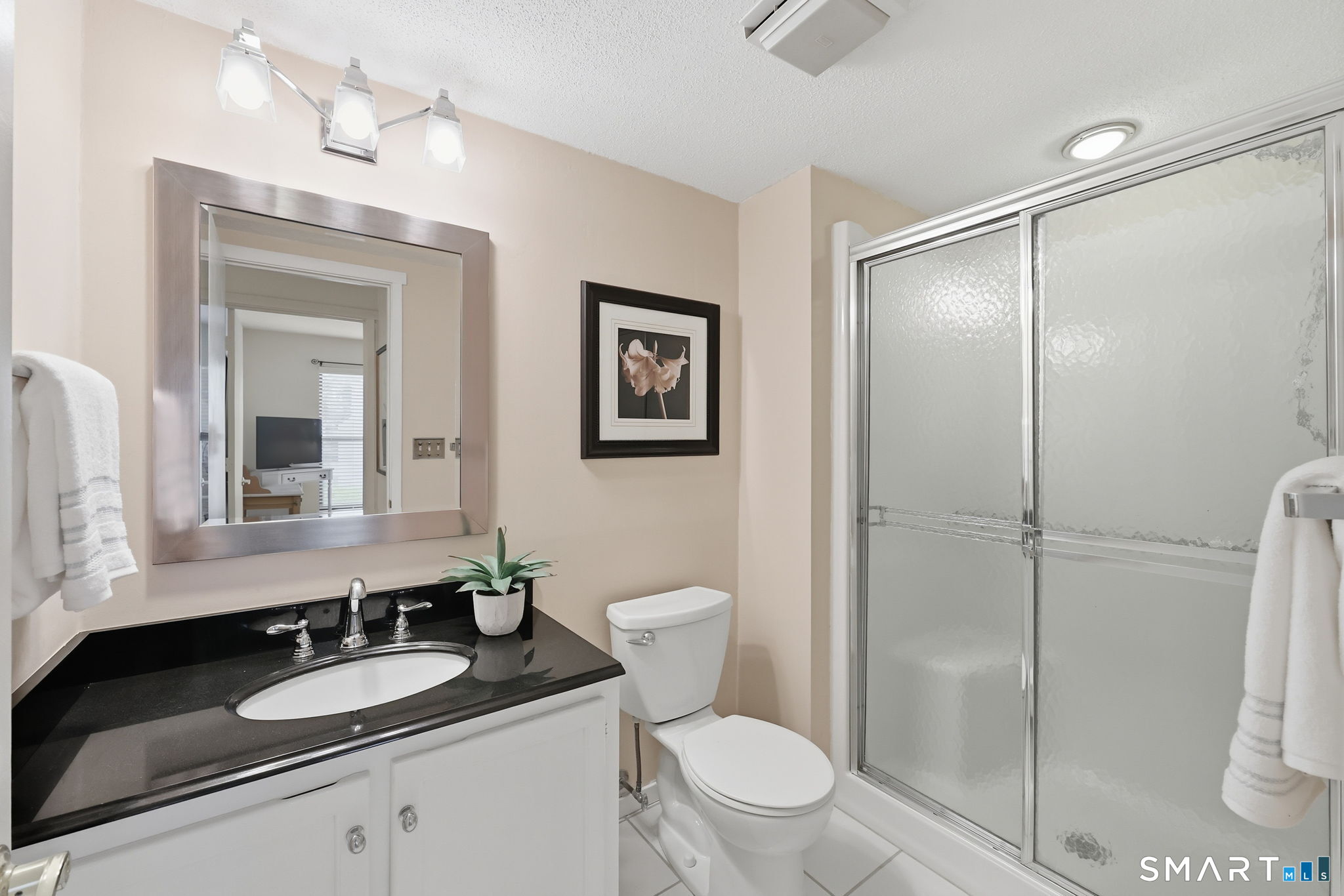 23 Maple Lane, Unit 23 Avon, CT 06001 - Photo 20 of 33 a bathroom with a granite countertop sink toilet and shower