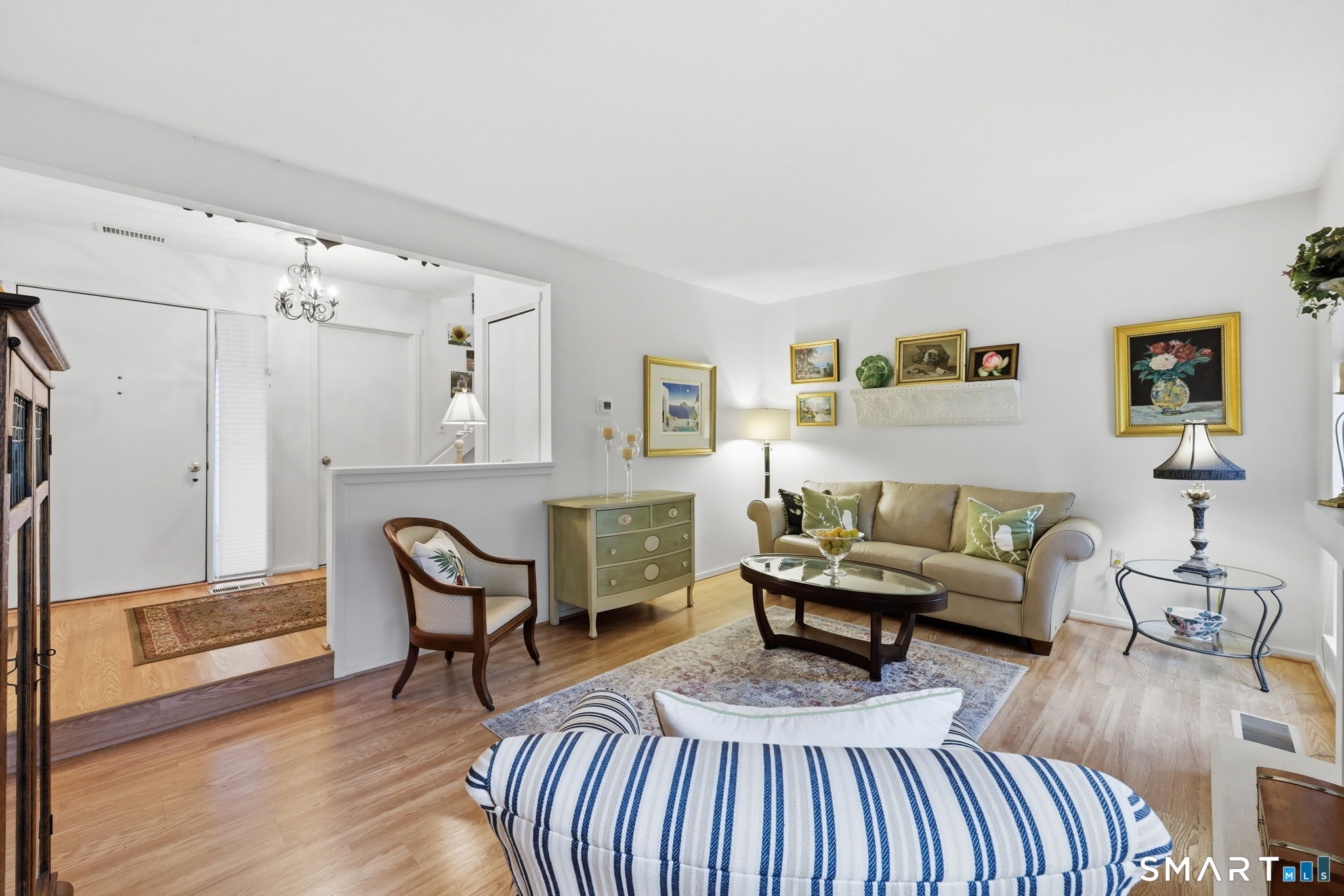 23 Maple Lane, Unit 23 Avon, CT 06001 - Photo 2 of 33 a living room with furniture a flat screen tv and a table