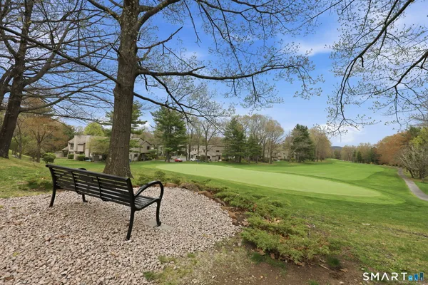a view of a bench in a garden
