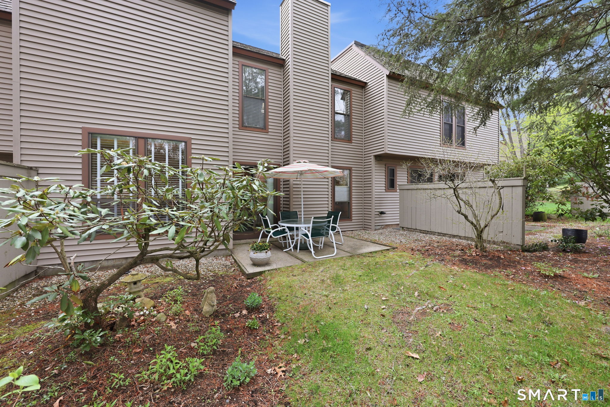 23 Maple Lane, Unit 23 Avon, CT 06001 - Photo 30 of 33 a view of a patio with table and chairs and potted plants