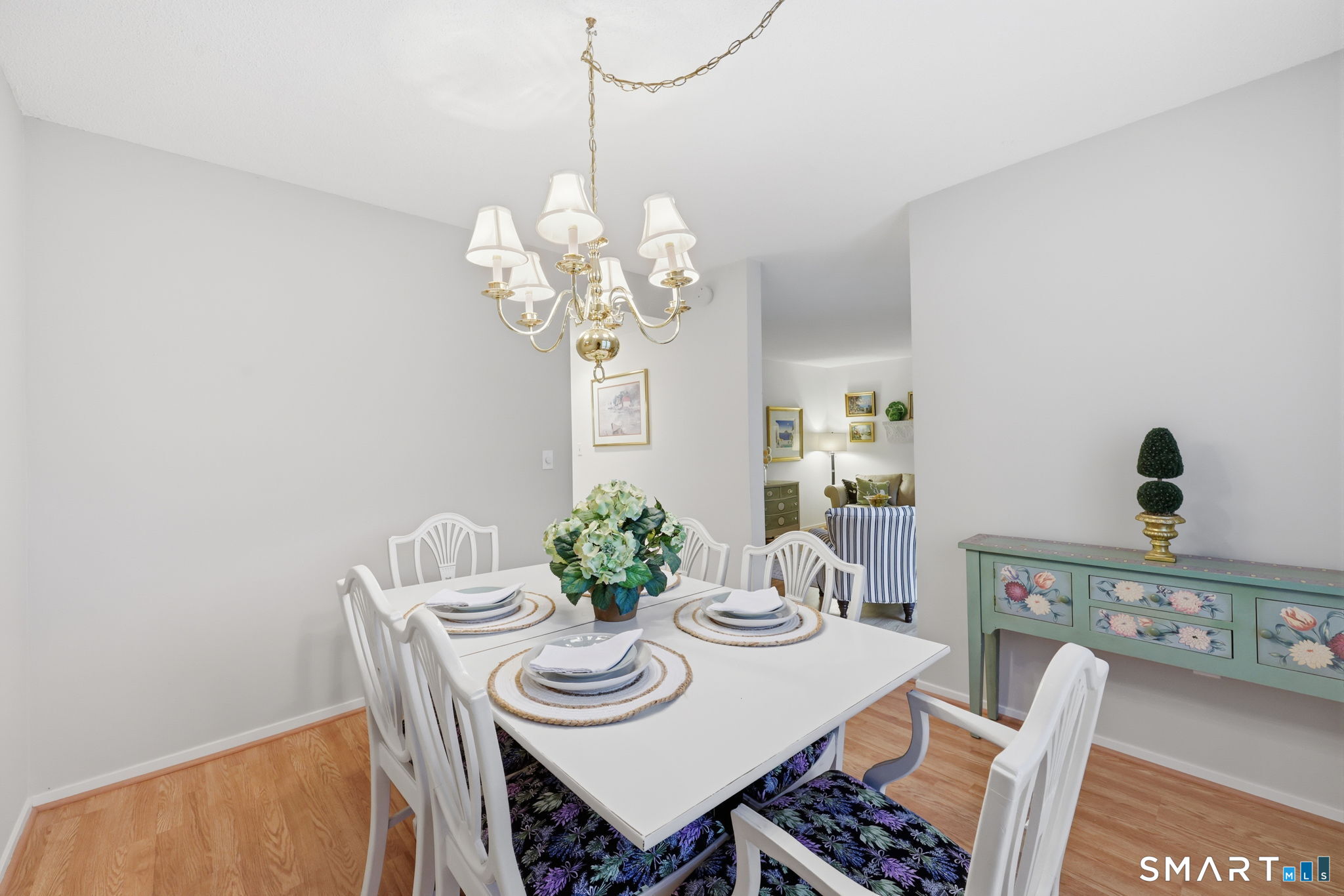 23 Maple Lane, Unit 23 Avon, CT 06001 - Photo 7 of 33 a view of a dining room with furniture and chandelier