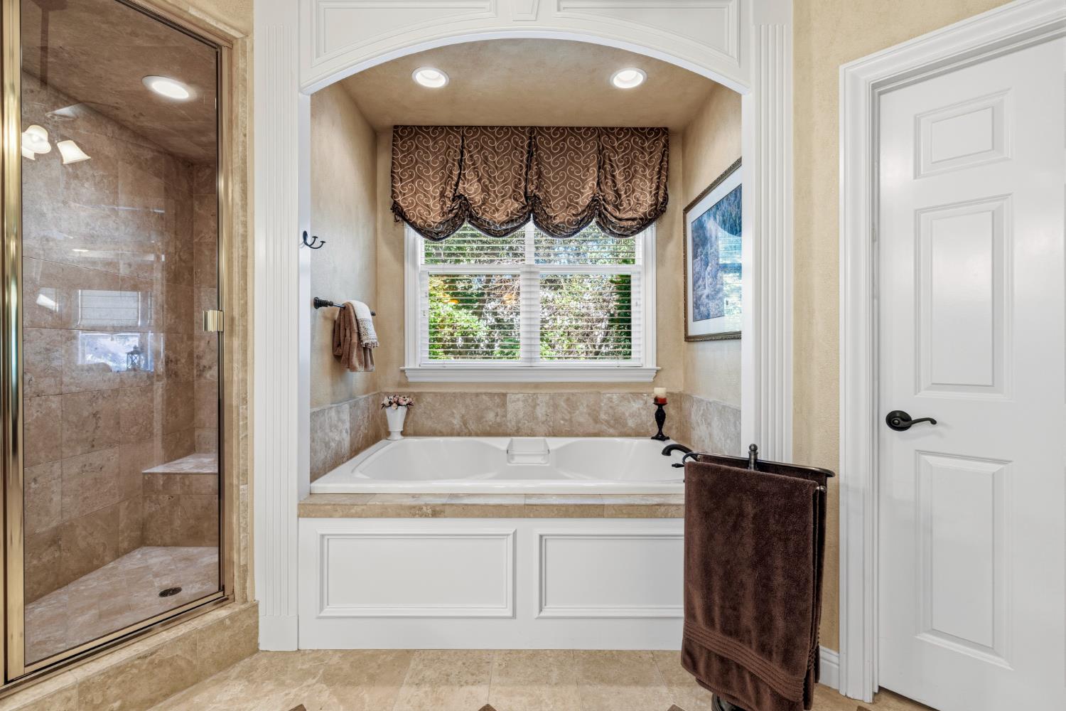 5869 Granite Hills Drive South Granite Bay, CA 95746 - Photo 25 of 66 a view of a bathroom with a tub and a shower