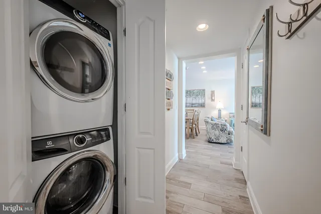 a view of a hallway with washer and dryer