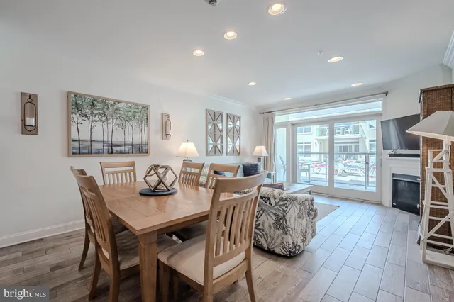 a dining room with furniture and wooden floor