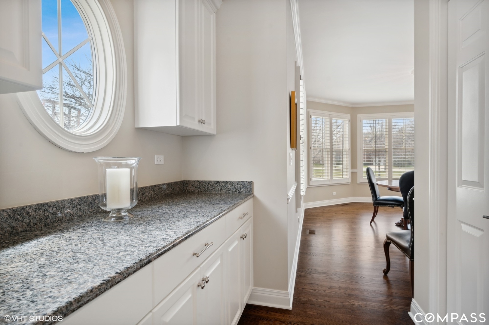 1437 Kittyhawk Lane Glenview, IL 60026 - Photo 11 of 39 a kitchen with granite countertop a sink a stove and a wooden floor