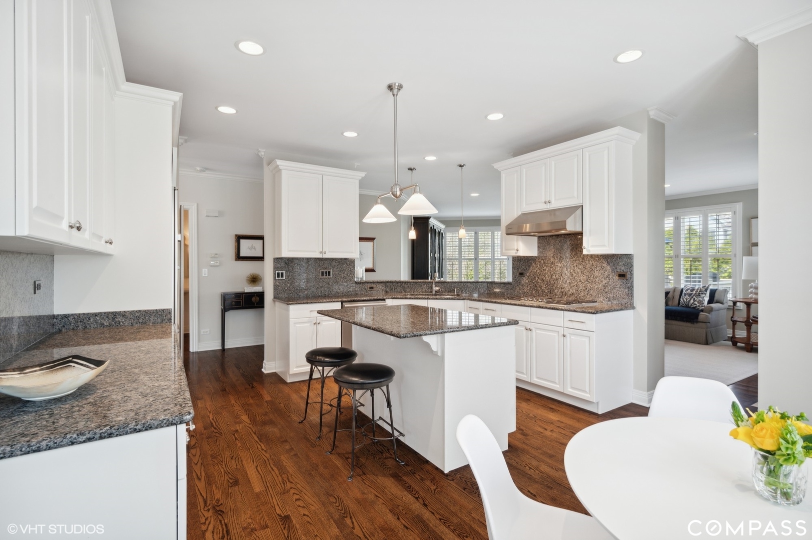 1437 Kittyhawk Lane Glenview, IL 60026 - Photo 12 of 39 a large kitchen with granite countertop lots of white cabinets stainless steel appliances and dining table