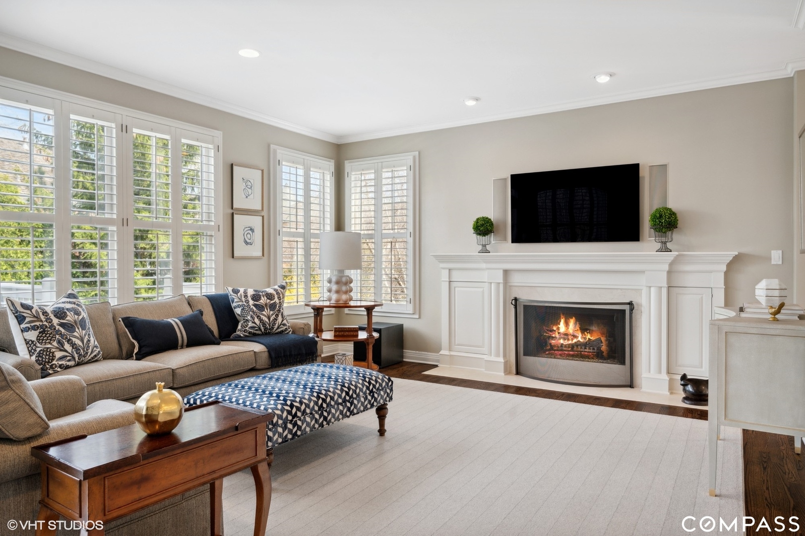 1437 Kittyhawk Lane Glenview, IL 60026 - Photo 15 of 39 a living room with furniture a fireplace and a flat screen tv