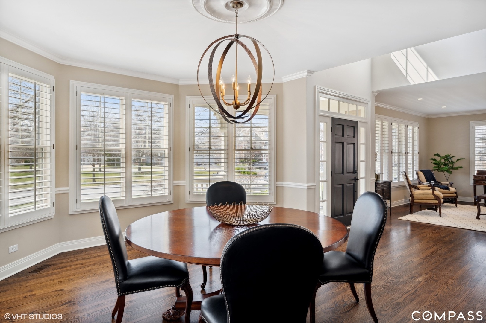 1437 Kittyhawk Lane Glenview, IL 60026 - Photo 8 of 39 a dining room with furniture a large window and wooden floor