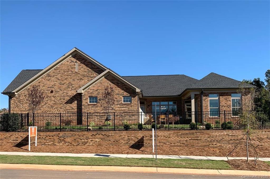 3002 Portico Place, Unit 38 Tega Cay, SC 29708 - Photo 11 of 38 a view of a house with a yard
