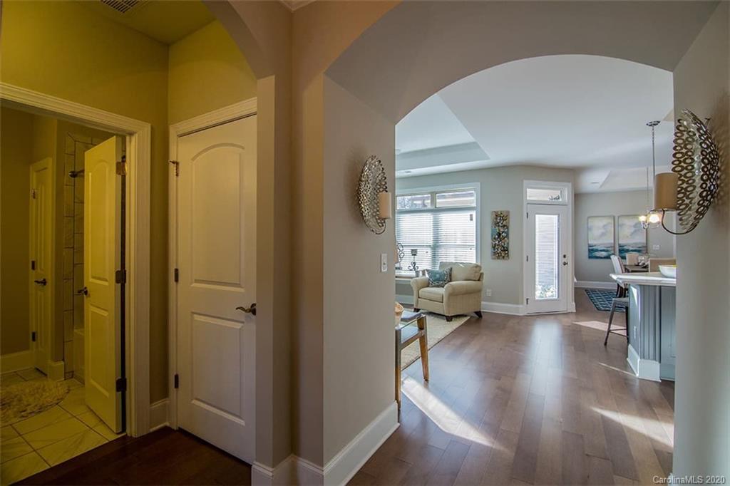 3002 Portico Place, Unit 38 Tega Cay, SC 29708 - Photo 14 of 38 a living room with furniture and a gate