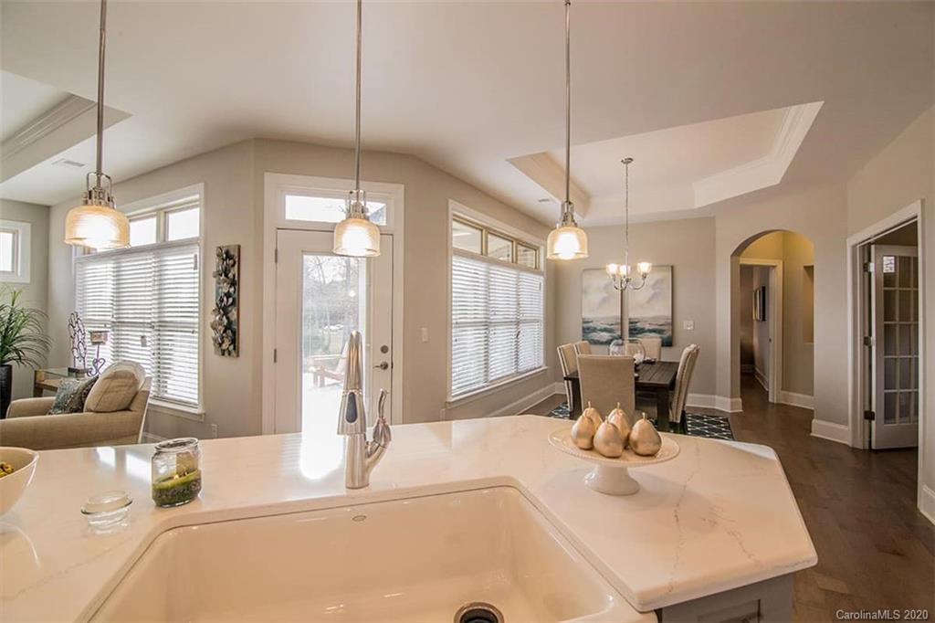 3002 Portico Place, Unit 38 Tega Cay, SC 29708 - Photo 18 of 38 a dining table with chairs and window